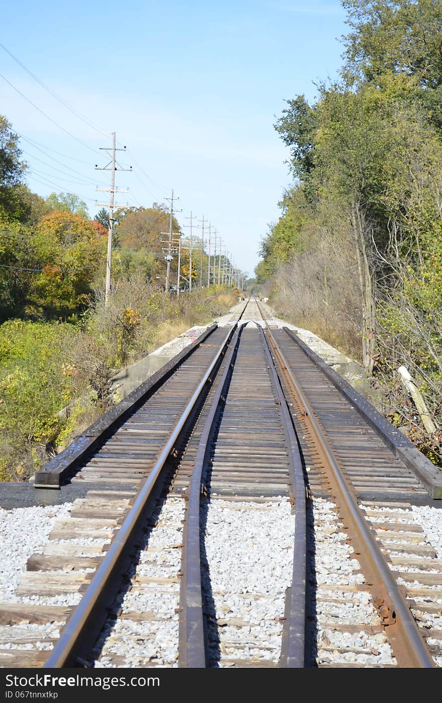 Railroad tracks slicing through the rural Michigan countryside. Railroad tracks slicing through the rural Michigan countryside