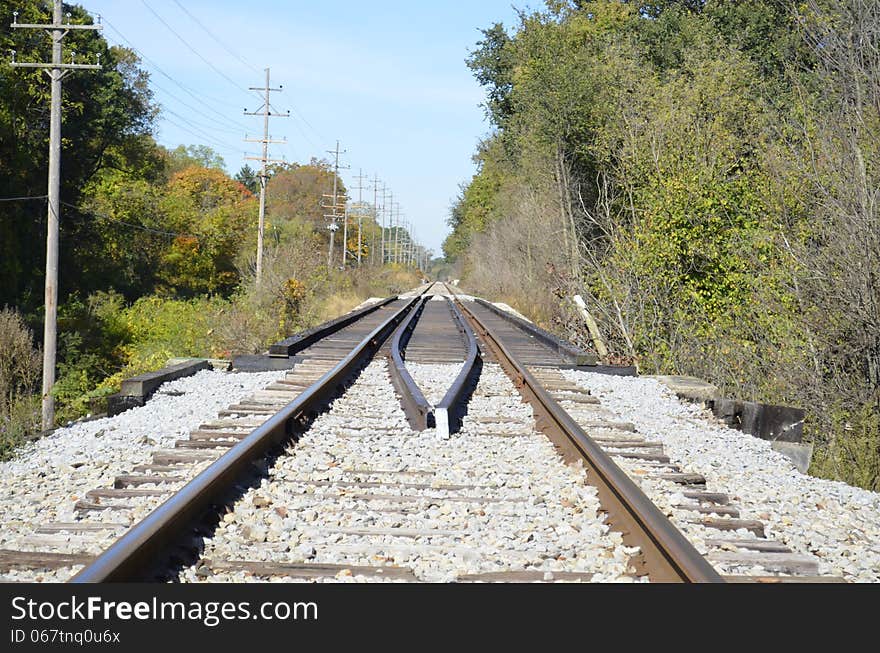 Railroad tracks slicing through the rural Michigan countryside. Railroad tracks slicing through the rural Michigan countryside