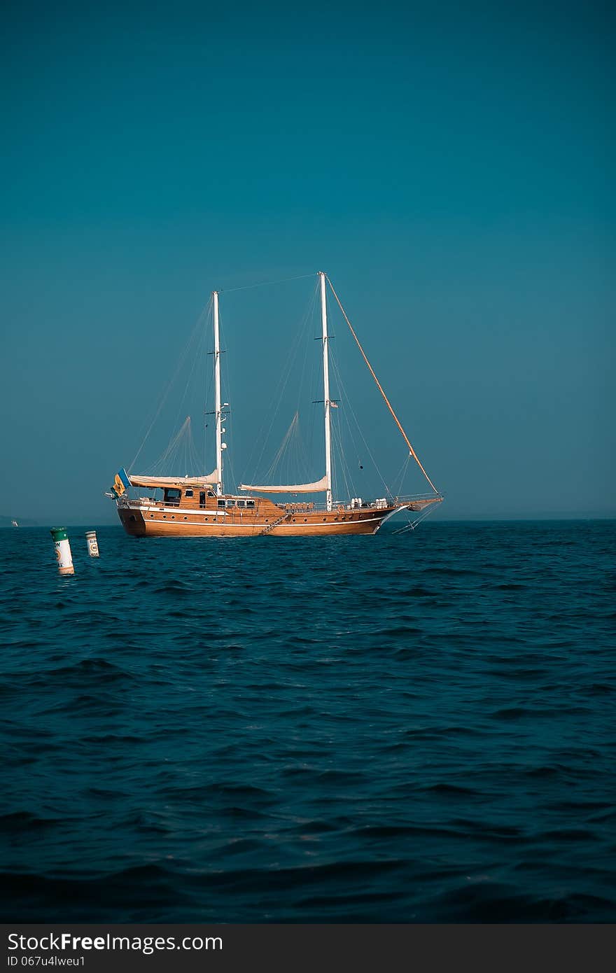 An old ship in a dark blue sea