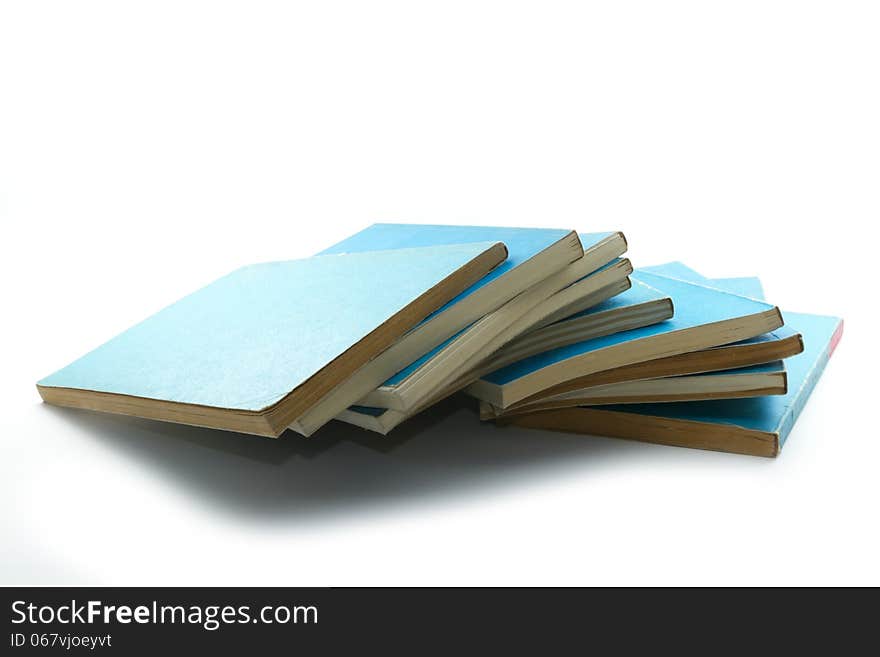 Pile of old blue hard cover books isolated on white. Pile of old blue hard cover books isolated on white