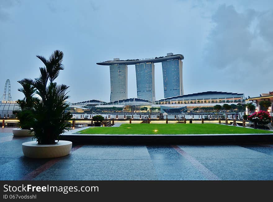 Marina Bay Sands is an Integrated Resort fronting Marina Bay in Singapore. Developed by Las Vegas Sands (LVS), it is billed as the world's most expensive standalone casino property at US$5.7 billion, including cost of the prime land. Marina Bay Sands is situated on 15.5 hectares of land with a built up area of 581,000 square metres of Gross Floor Area. iconic design have transformed the Singapore's skyline and its tourism landscape since it opened on 27 April 2010. The property has a hotel, convention and exhibition facilities, theatres, entertainment venues and shopping and dining retailers.