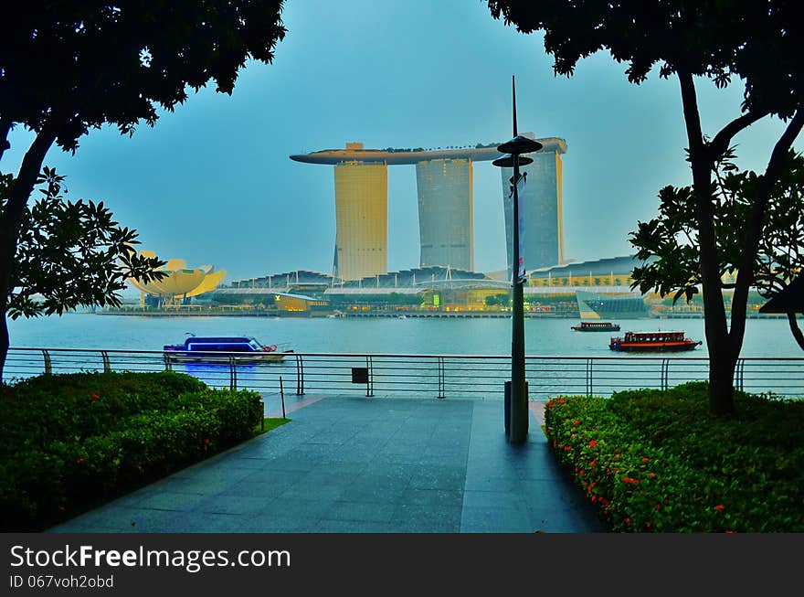 Marina Bay Sands is an Integrated Resort fronting Marina Bay in Singapore. Developed by Las Vegas Sands (LVS), it is billed as the world's most expensive standalone casino property at US$5.7 billion, including cost of the prime land. Marina Bay Sands is situated on 15.5 hectares of land with a built up area of 581,000 square metres of Gross Floor Area. iconic design have transformed the Singapore's skyline and its tourism landscape since it opened on 27 April 2010. The property has a hotel, convention and exhibition facilities, theatres, entertainment venues and shopping and dining retailers.