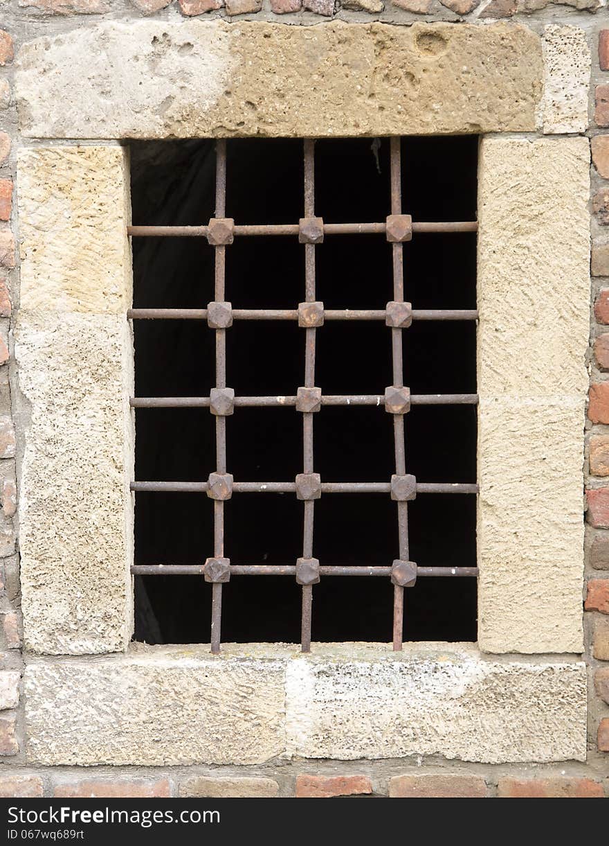 Old fortress prison bar window. Old fortress prison bar window