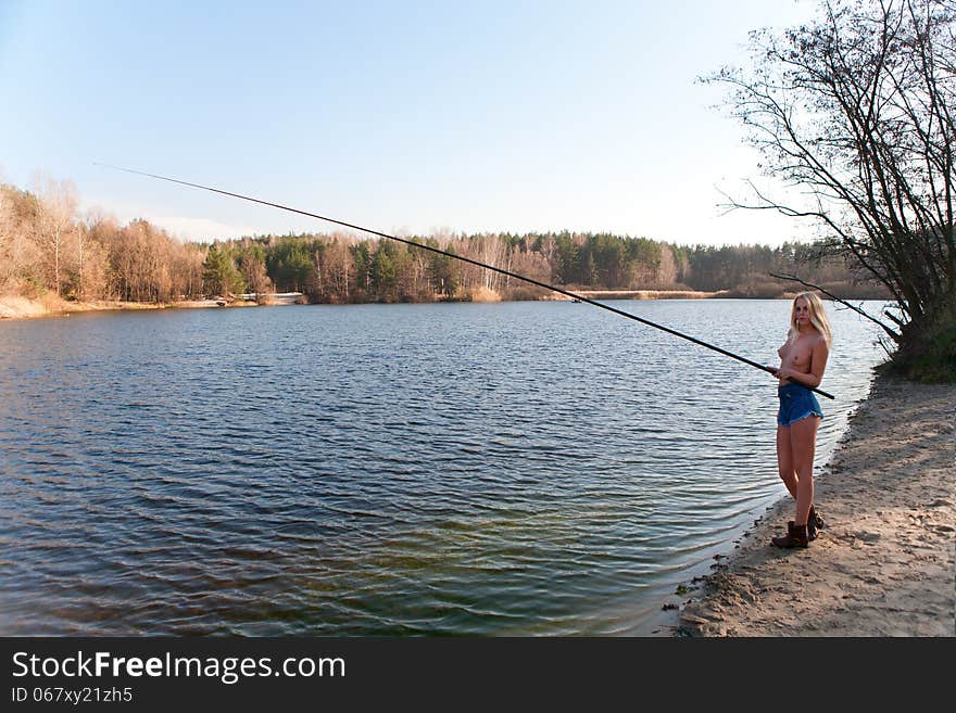 Topless Girl Fishing At The River