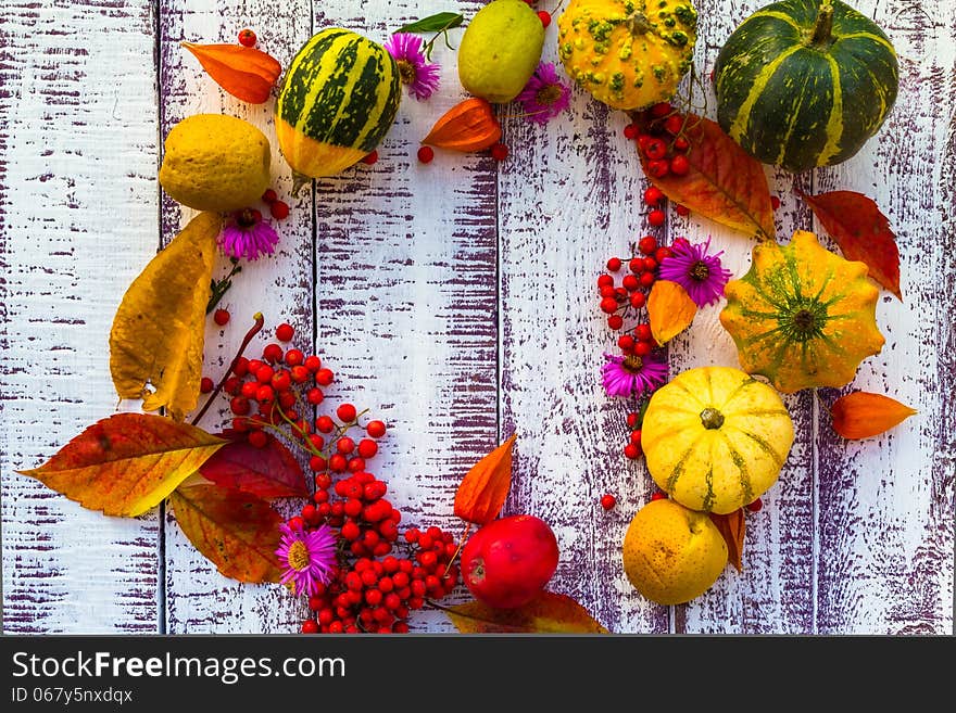 Autumn setting on the wooden table with fruits and vegetables. Autumn setting on the wooden table with fruits and vegetables