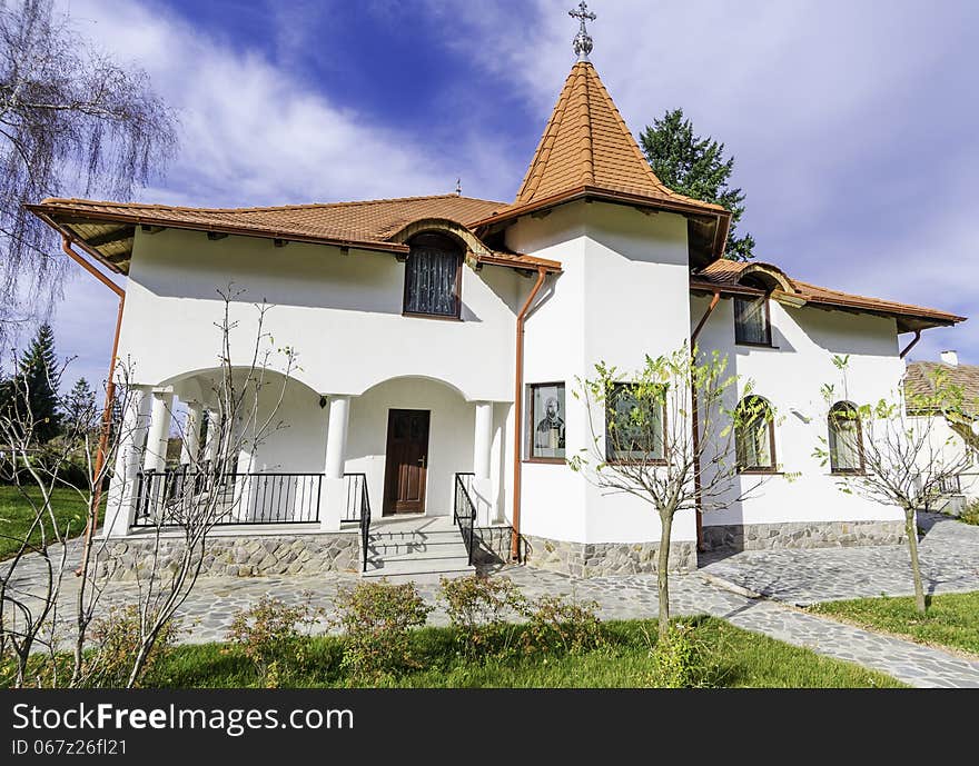 A small cottage in the Sambata Monastery resort - in the heart of Carpathian chain of mountains - a sunny autumn sunday right after the liturgy. These cottages were built by the monks for the monks and they serve as private conventicles and hermitage. A small cottage in the Sambata Monastery resort - in the heart of Carpathian chain of mountains - a sunny autumn sunday right after the liturgy. These cottages were built by the monks for the monks and they serve as private conventicles and hermitage.