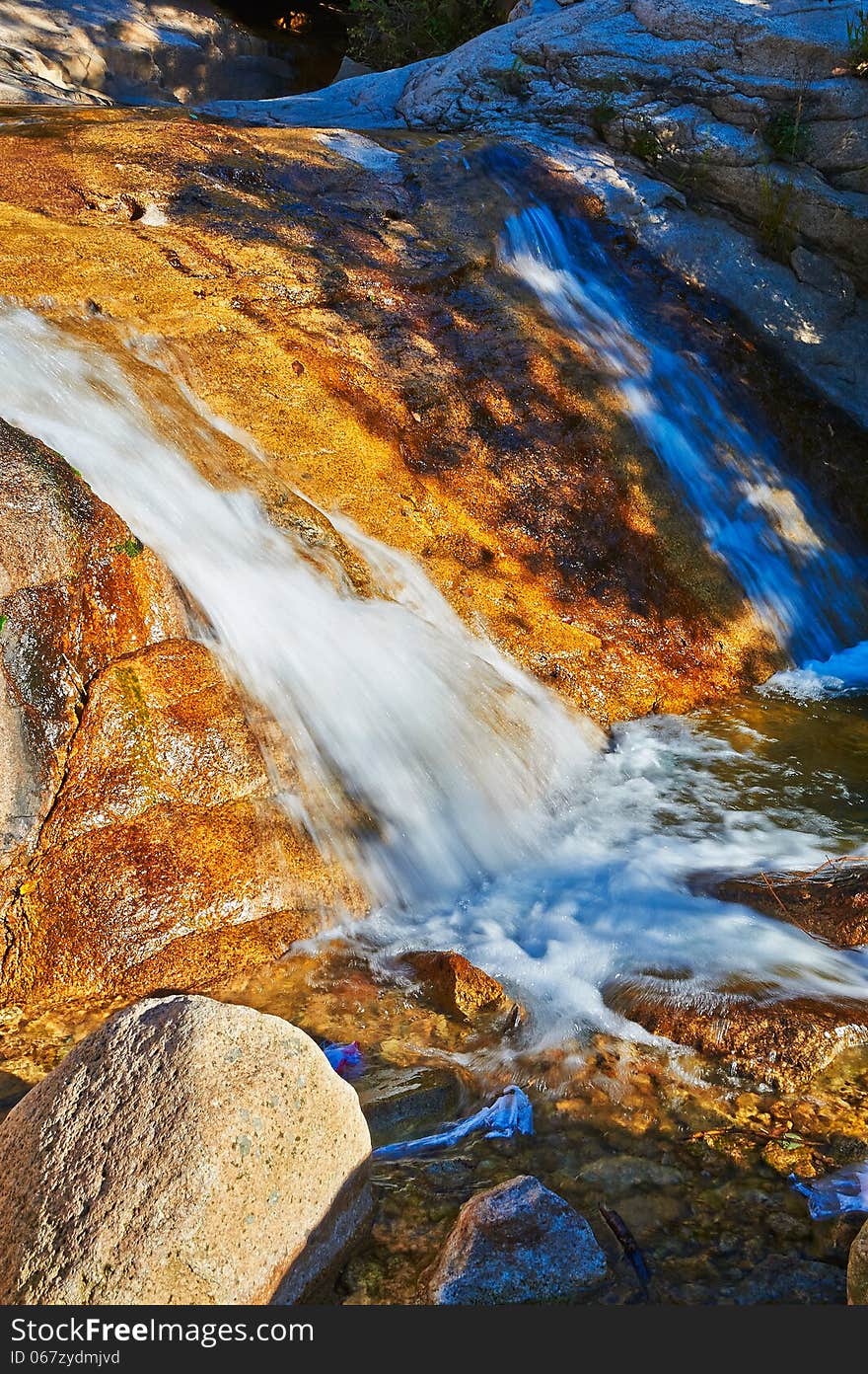 The megalith and waterfall