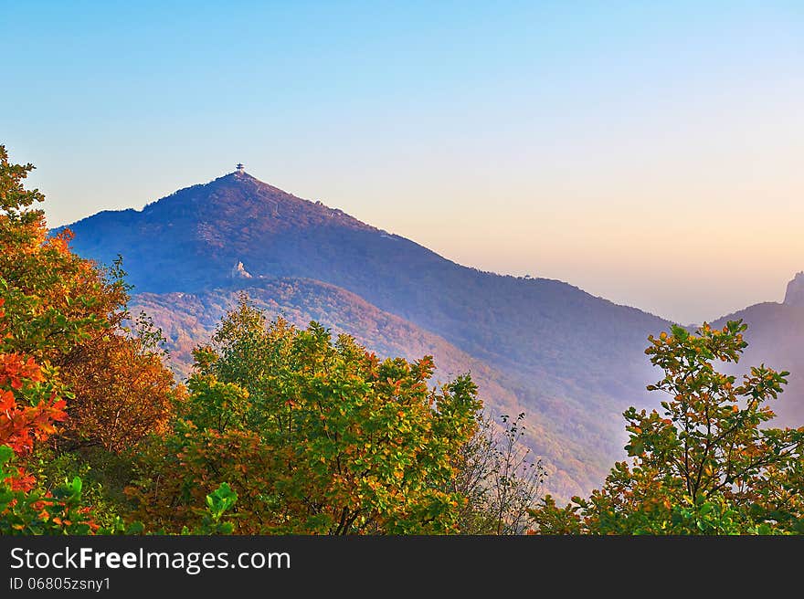 The Apsara peak and autumn trees sunset