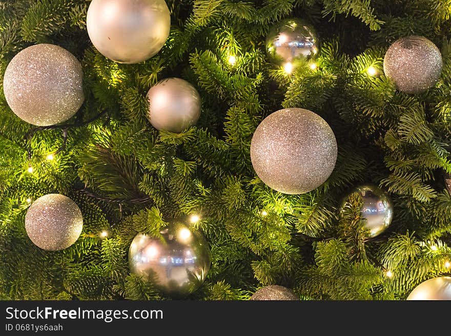 Glittery Silver Baubles on Green Pine Tree with Fairy LIghts. Glittery Silver Baubles on Green Pine Tree with Fairy LIghts