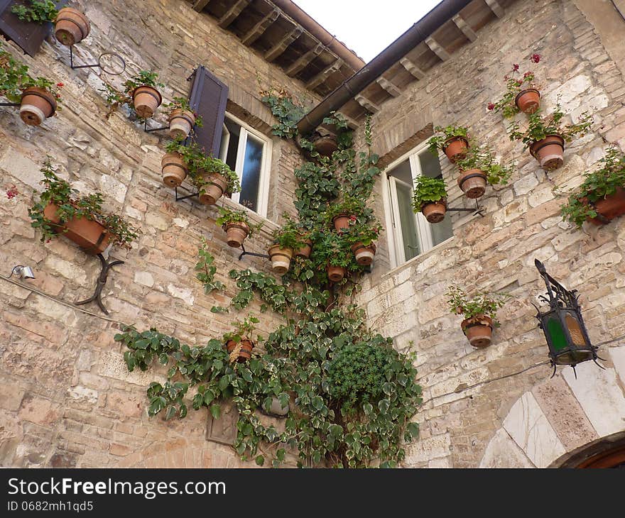 A house in San Marino decorated with pots of flowers. A house in San Marino decorated with pots of flowers