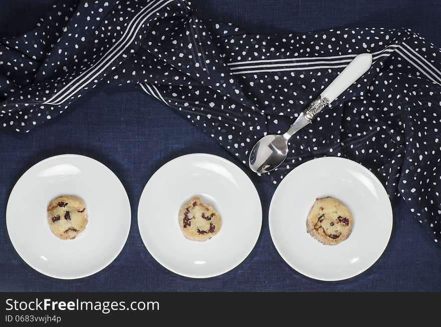 Porcelain dishes and cookies with cranberries