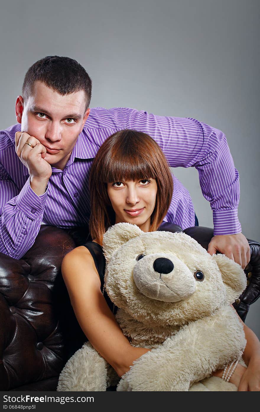 Boy, girl and teddy bear