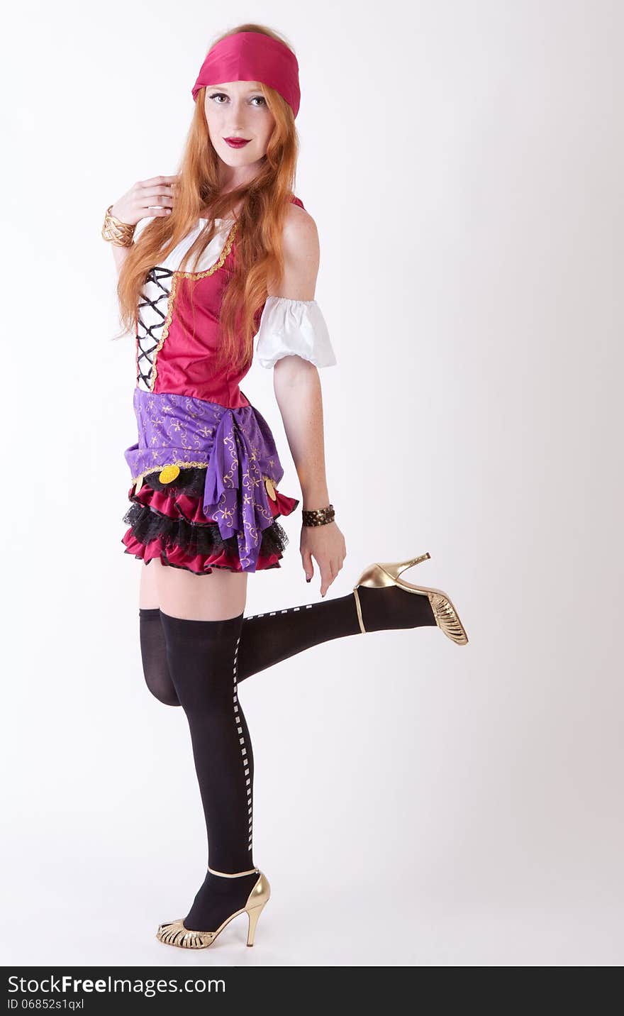 An image of an attractive young woman in a pirate costume. An image of an attractive young woman in a pirate costume