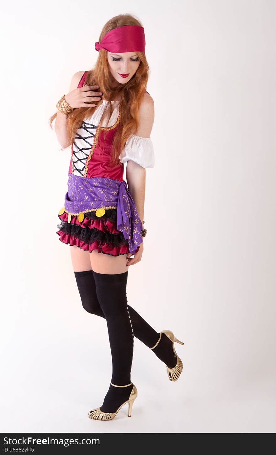 An image of a young woman dressed in a pirate costume. An image of a young woman dressed in a pirate costume