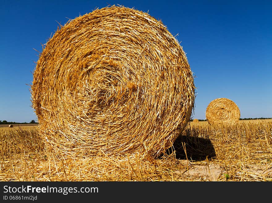 Straw bales in the light of sunset