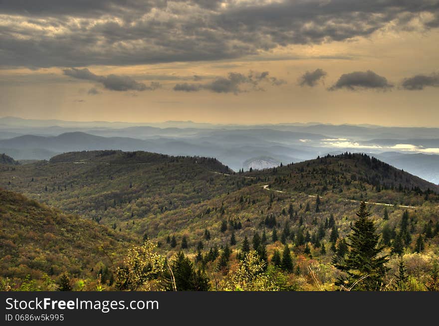 The Blue Ridge Mountains with Looking Glass Rock in the Distance. This is taken near the Blue Ridge Parkway in the Autumn. The Blue Ridge Mountains with Looking Glass Rock in the Distance. This is taken near the Blue Ridge Parkway in the Autumn