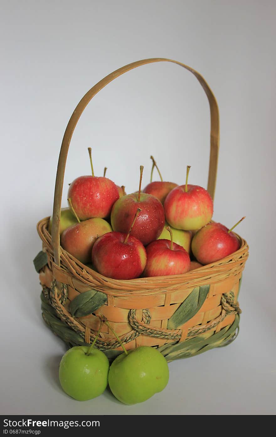 Basket of crabapples isolated on a white background.