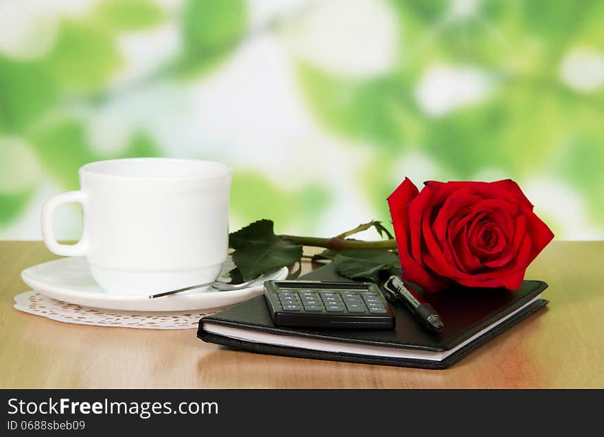 Table In Cafe With A Cup Of Coffee, Rose And