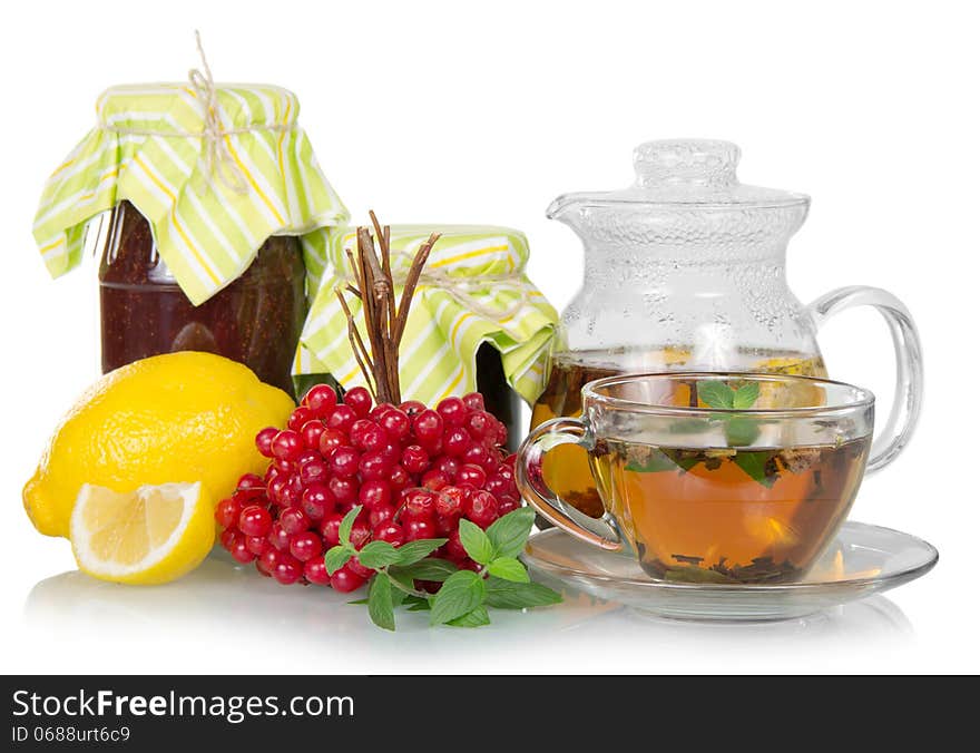 Tea, mint, lemon, guelder-rose, jam isolated on a white background