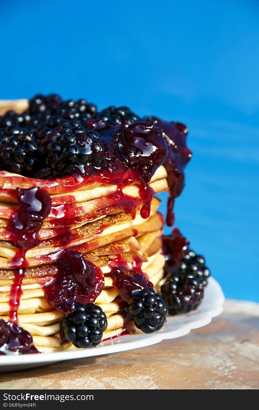 Pancakes and blackberry with syrup poured on top. Pancakes and blackberry with syrup poured on top