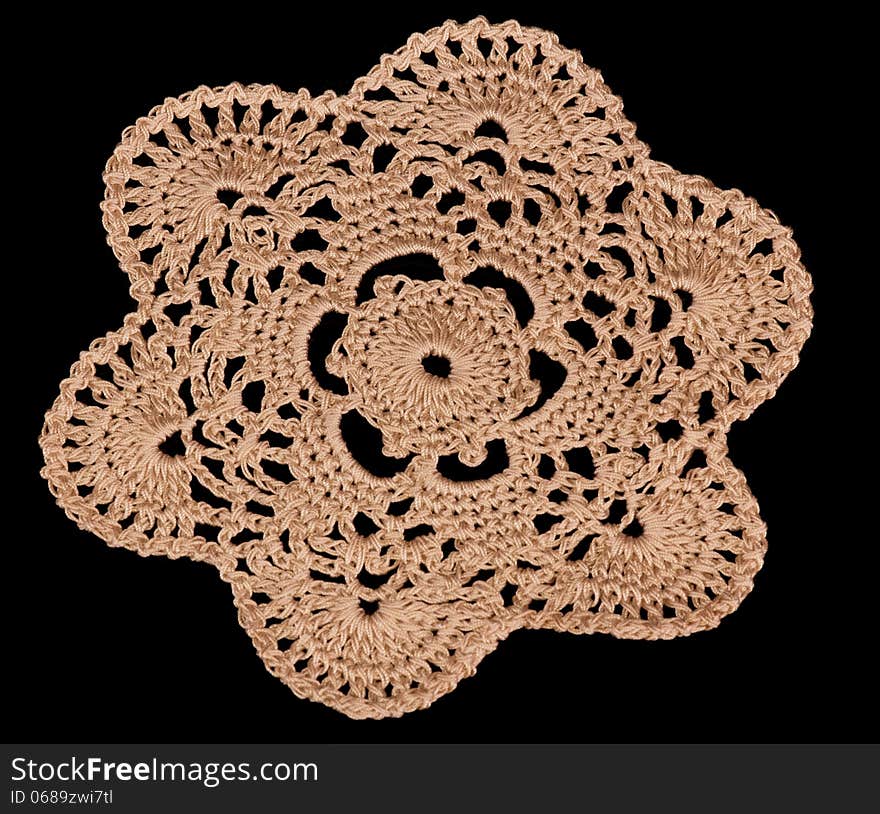 Lacy napkin isolated on black