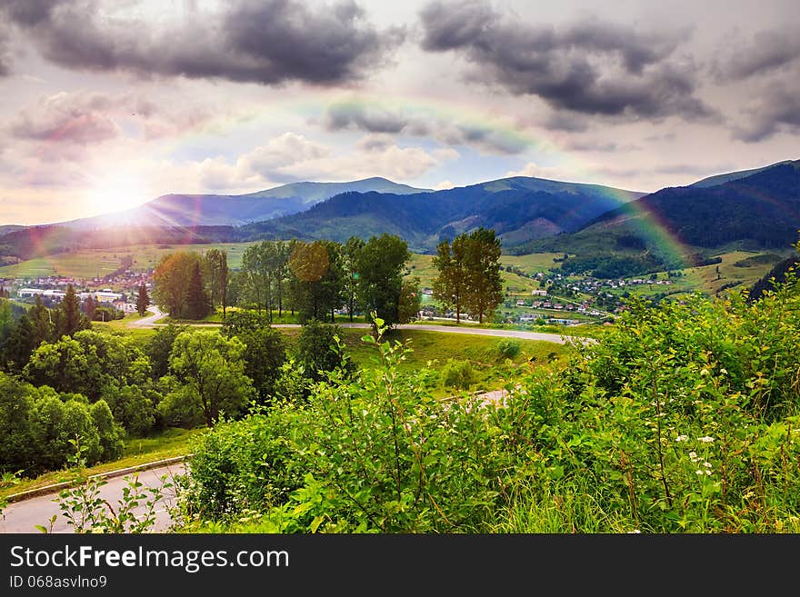 Valley near forest on a steep mountain slope after the rain in evening mood