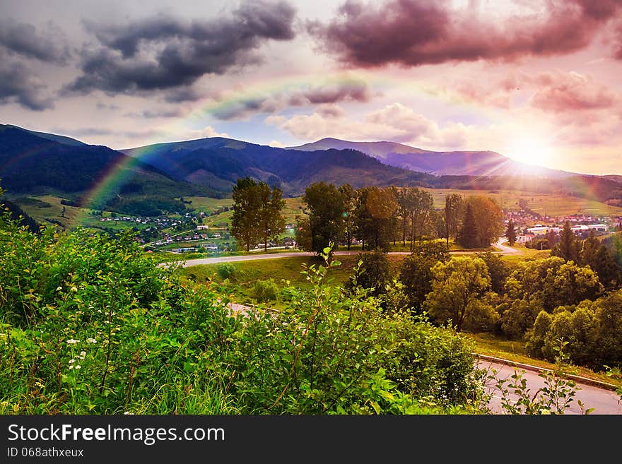 Valley near forest on a steep mountain slope after the rain in evening mood