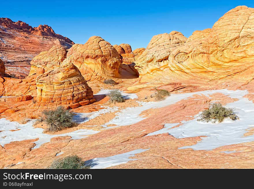 Hiking through The Wave is comparable to walking through a spectacular maze of swirling, undulating rock. Hiking through The Wave is comparable to walking through a spectacular maze of swirling, undulating rock.