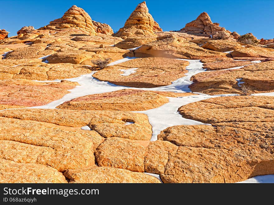 As one hikes through these fantastic rock formations, seen are orange-colored boulders, and cone-like mini-hills, partially covered with snow when I visited in January. As one hikes through these fantastic rock formations, seen are orange-colored boulders, and cone-like mini-hills, partially covered with snow when I visited in January.