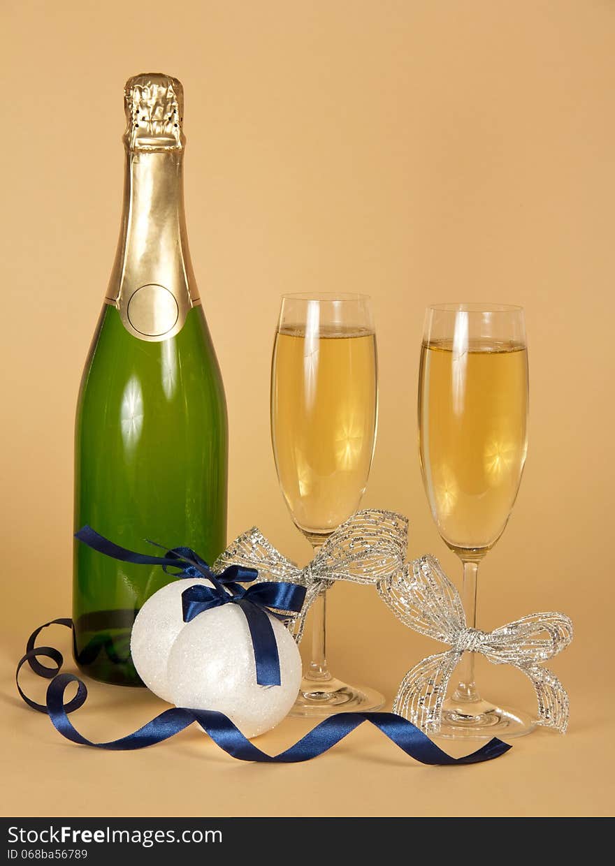 Bottle and wine glasses with champagne