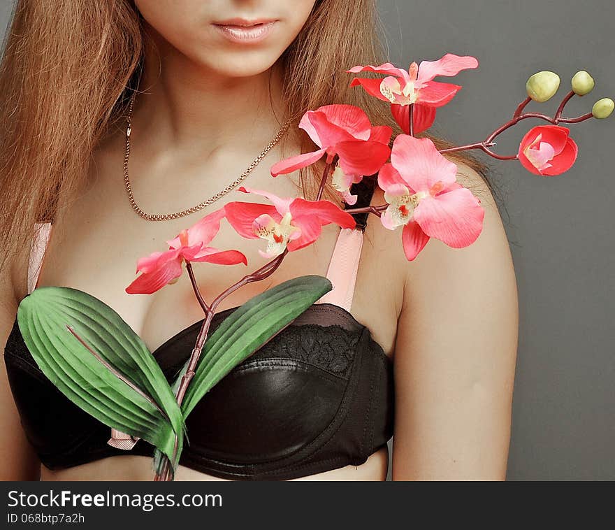 Healthy white girl holding a red orchid