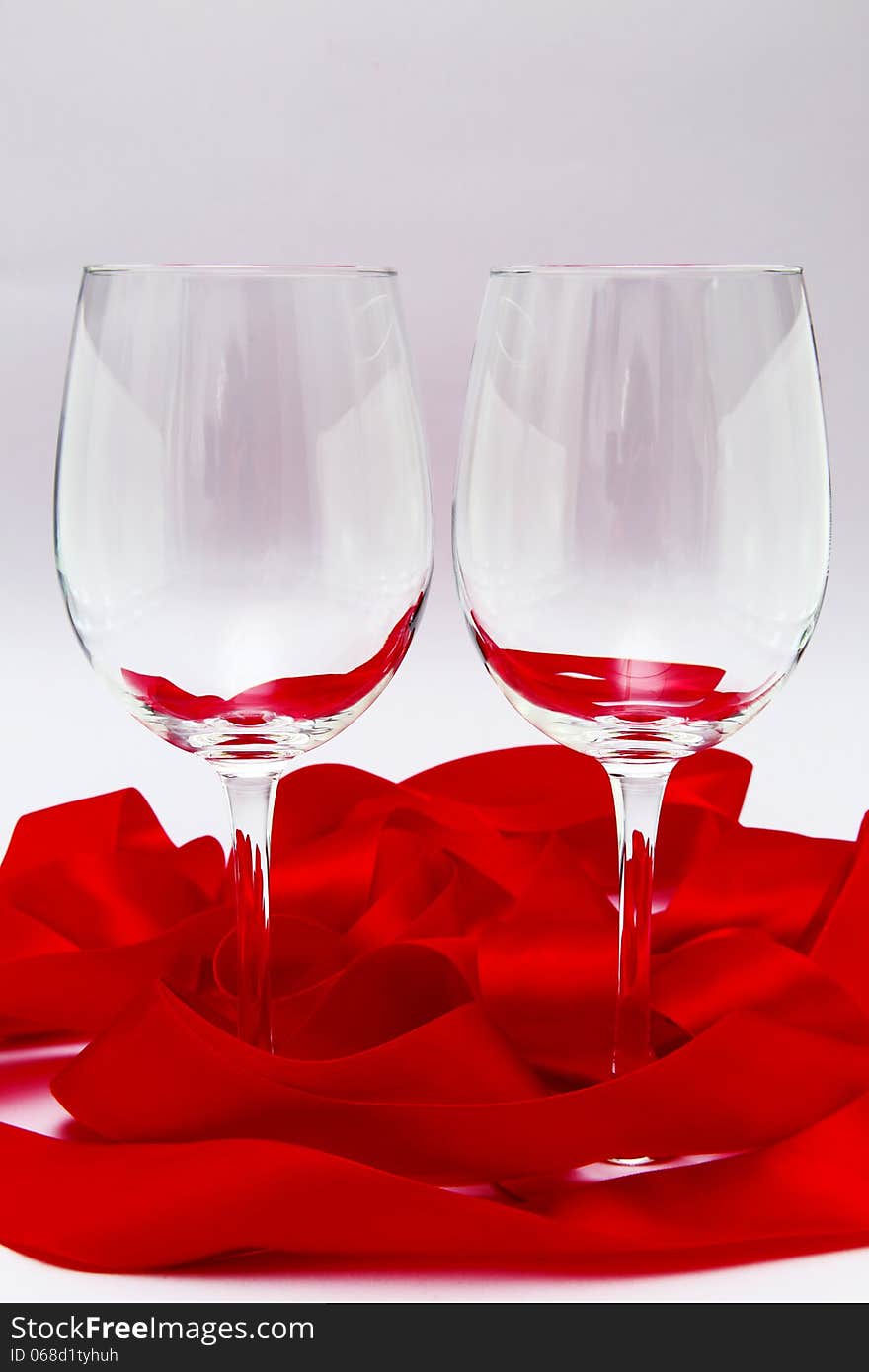 Empty Wineglasses With Red Ribbon