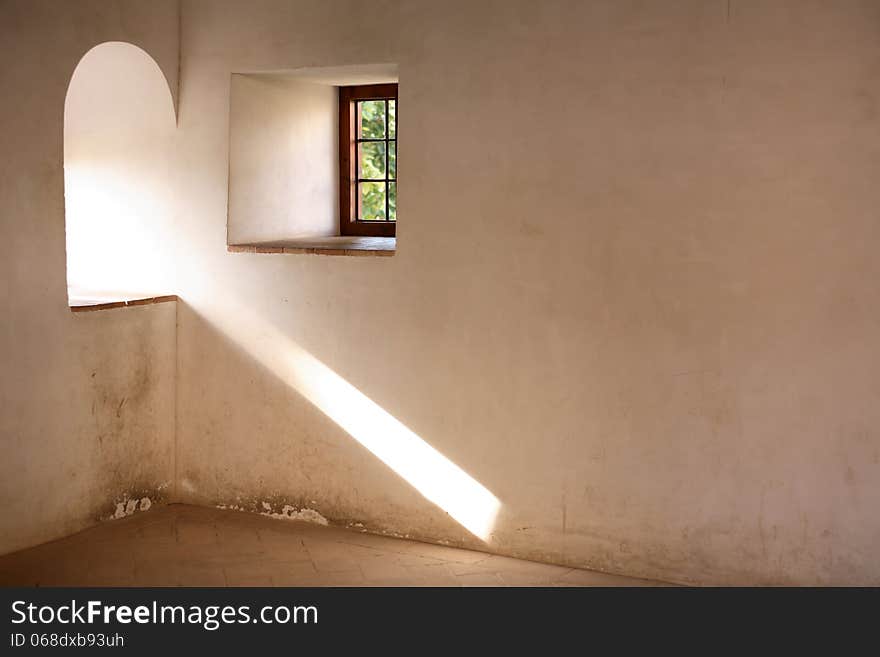 Two old windows with sunbeam on the wall. Alhambra, Granada,Spain. Two old windows with sunbeam on the wall. Alhambra, Granada,Spain