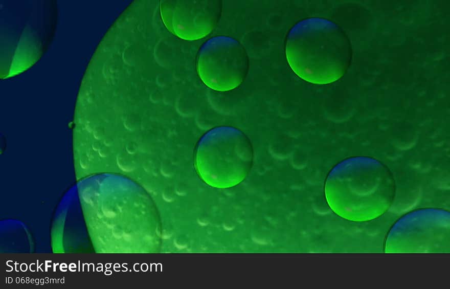 Blue-green background with bubbles