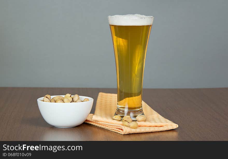 Glass Of Beer, Bowl With Pistachios