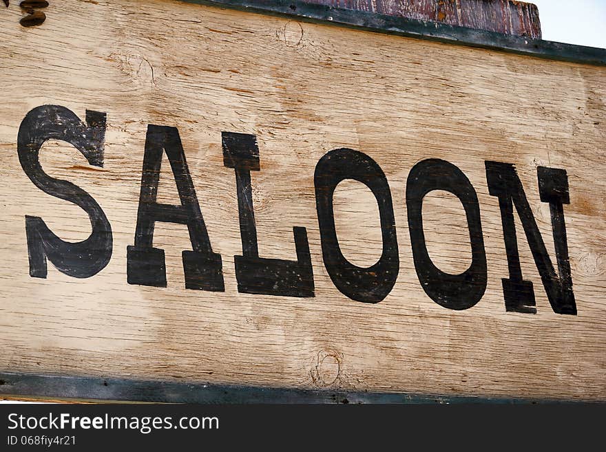 Weathered hand-painted sign on old west ghost town. Weathered hand-painted sign on old west ghost town