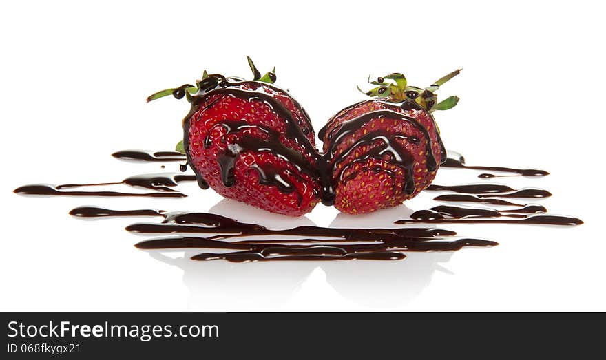 Fresh fragrant strawberry, decorated with chocolate, isolated on white