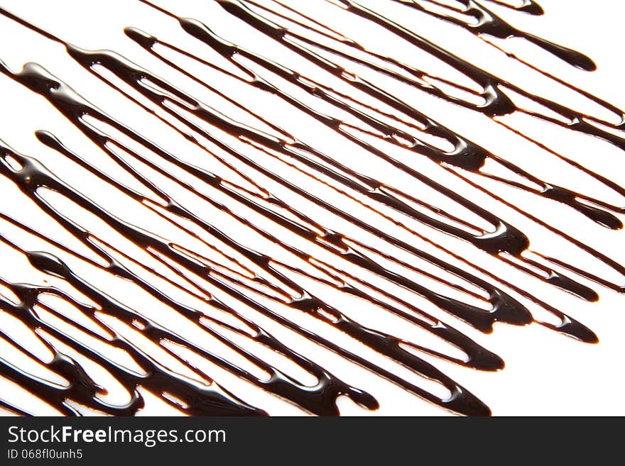 Thin streams of melted chocolate