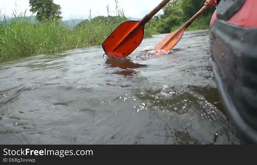 Canoe rowing paddle in the river. Canoe rowing paddle in the river