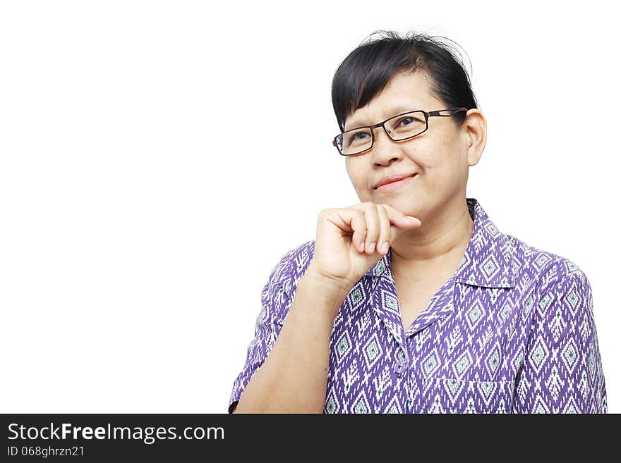 Senior woman smilingly and touching her chin