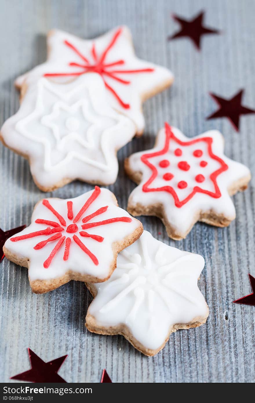 Gingerbread cookies over wooden background