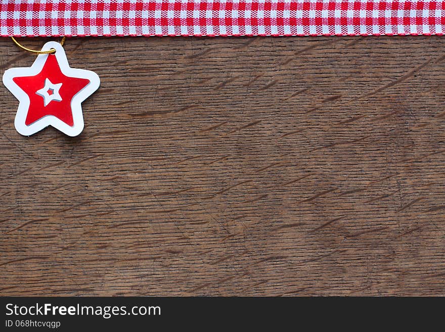 Paper star on a  wooden  background