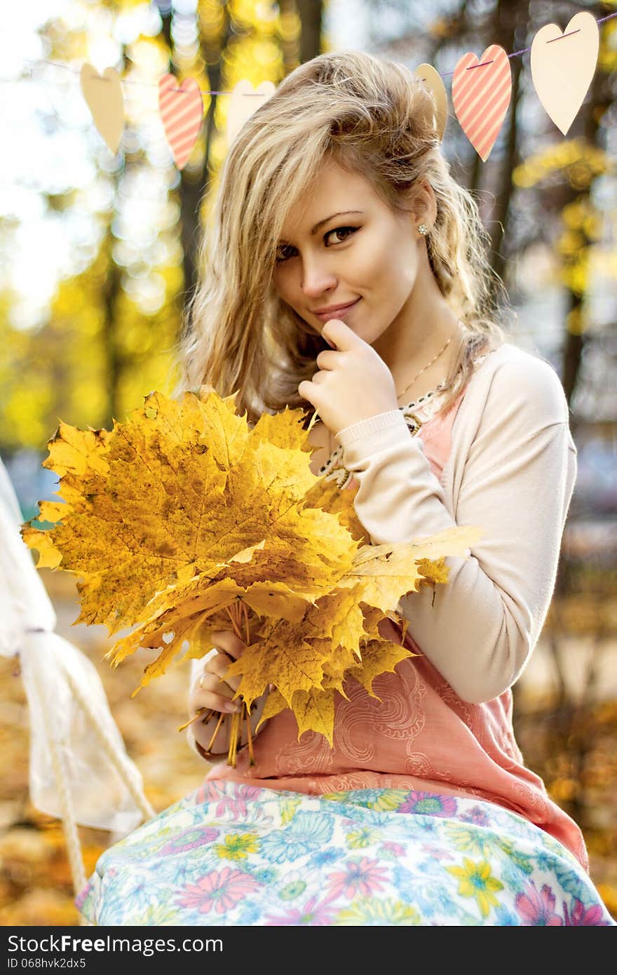 Smiling girl with autumn leaves. Smiling girl with autumn leaves