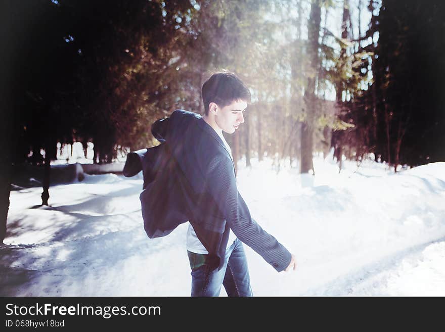 Portrait of a man dancing in snow forest