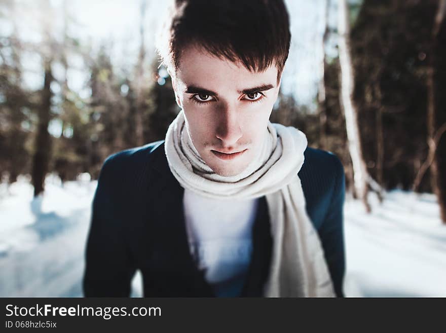 Portrait of a man in snow forest