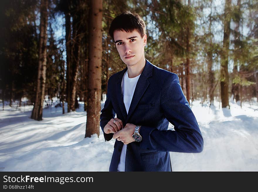 Portrait Of A Man In Suit In Snow Forest