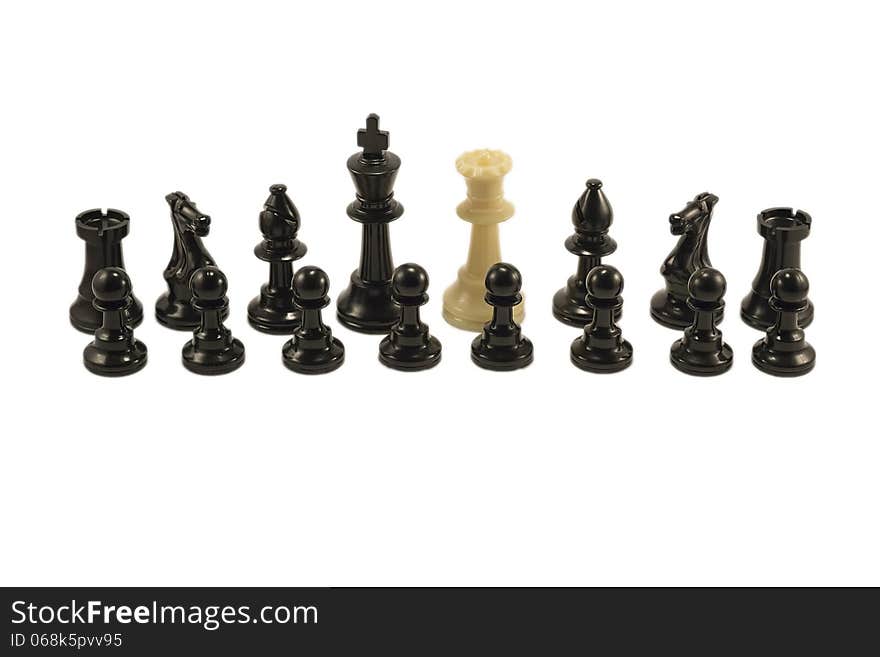 White queen standing alongside with the black chess pieces. White queen standing alongside with the black chess pieces