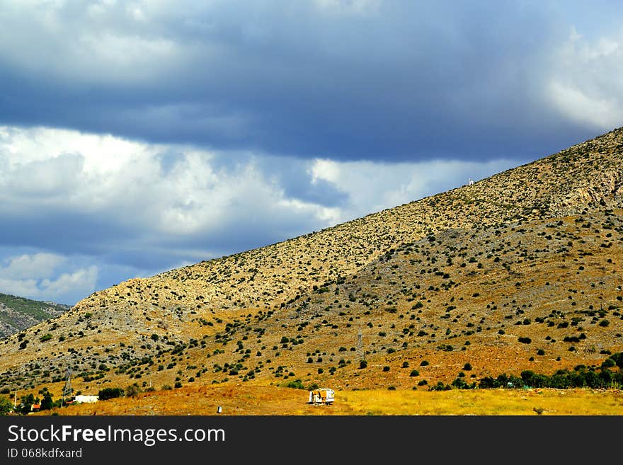 Autumn lanscape under a cloudy sky in a warm autumn day. Autumn lanscape under a cloudy sky in a warm autumn day