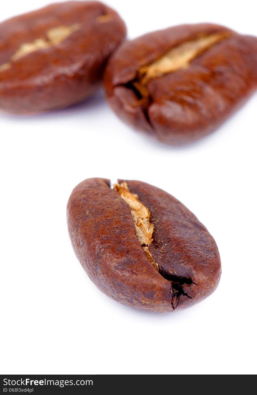 Three Perfect Roasted Coffee Beans isolated on white background