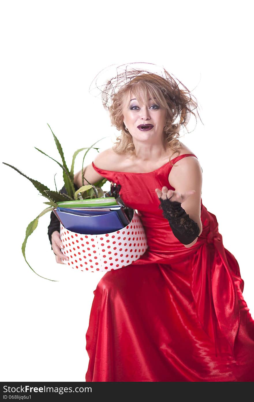 Fired actress in a red dress with a box of things express her emotions on a white background. Fired actress in a red dress with a box of things express her emotions on a white background